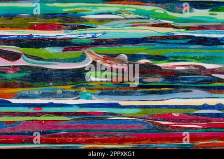 Resin from the process of surfboard making. Lots of layers that take a lot of time and work to build up. Each color is a different surfboard that was Stock Photo
