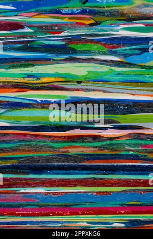 Resin from the process of surfboard making. Lots of layers that take a lot of time and work to build up. Each color is a different surfboard that was Stock Photo