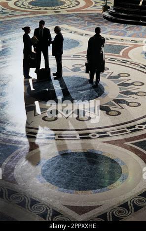 Group of business executives standing together Stock Photo - Alamy