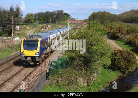 Northern Trains Civity class 195 dmu 195104 Deva Victrix West Coast Main Line in countryside at Woodacre near Garstang, Lancashire, 25th April 2023. Stock Photo