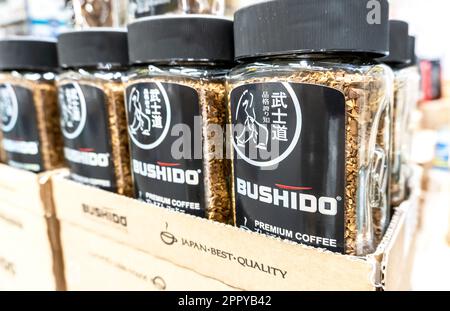 Samara, Russia - April 20, 2023: Bushido coffee ready for sale on the shelf in a superstore. Selective focus Stock Photo