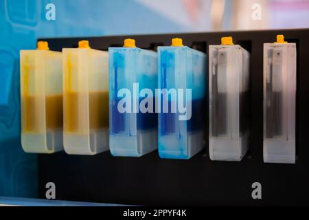 Row of inkjet printer CMYK cartridges - close up Stock Photo