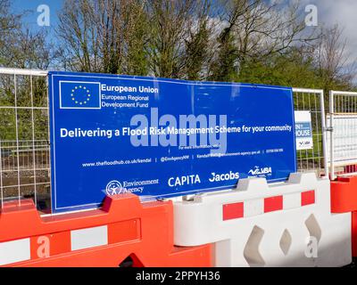 A sign about new flood defences being built on the River Kent in Kendal, Cumbria, UK. Stock Photo
