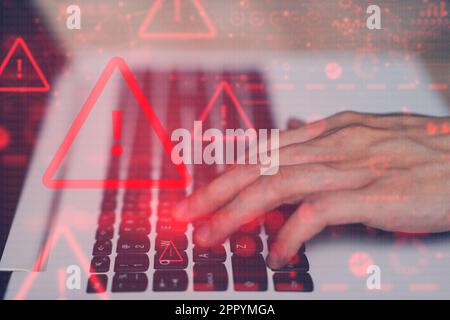System hacked warning alert on notebook (Laptop). Cyber attack on computer network, Virus, Spyware, Malware or Malicious software. Cyber security and Stock Photo