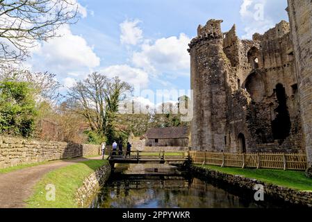 Nunney Castle and moat in the village of Nunney. Built in the 1370s by Sir John de la Mere, Somerset, England, United Kingdom - 8th of April 2023 Stock Photo