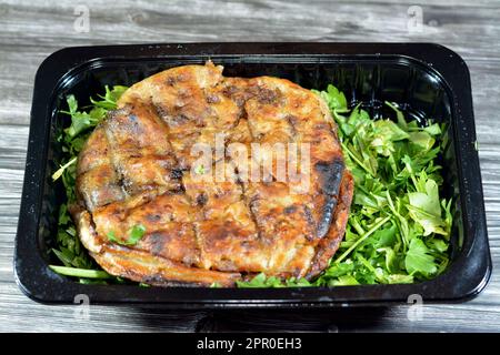 Traditional Egyptian dish Hawawshi, pita stuffed with minced meat and spiced with onions, pepper, parsely and chilies, baked by filling flat Egyptian Stock Photo