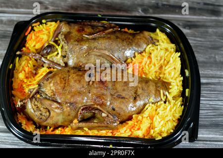 Egyptian Hamam Mahshi stuffed squab, Arabic cuisine, Egyptian traditional stuffed pigeon dish filled with rice and Freekeh cracked green wheat grains, Stock Photo