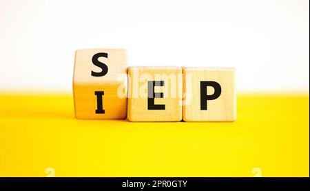 SEP or IEP symbol. Concept words IEP initial enrollment period SEP special enrollment period. Beautiful yellow table white background. Medical initial Stock Photo