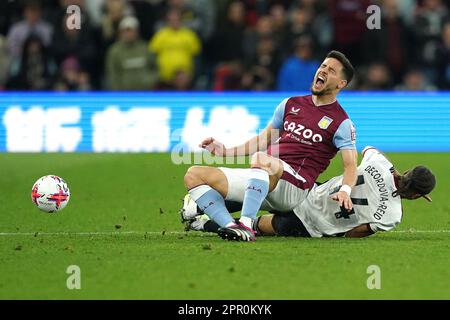 Aston Villa's Alex Moreno is tackled by Fulham's Bobby Decordova-Reid during the Premier League match at Villa Park, Birmingham. Picture date: Tuesday April 25, 2023. Stock Photo