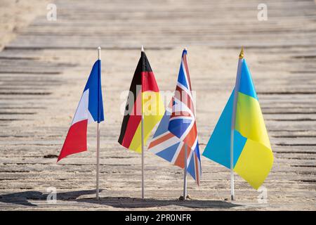 Flags of Germany and France and Great Britain and Ukraine on the sand in Ukraine on the shore, flags of countries Stock Photo