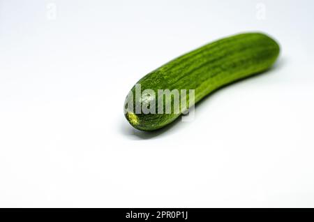 Fresh Whole Cucumber on White Background, Vertical Close-Up Shot Stock Photo