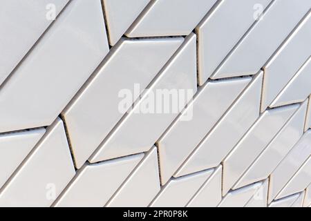 Angled white tile pattern perspective close up background Stock Photo