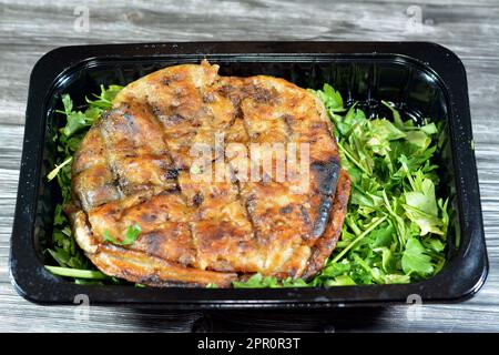 Traditional Egyptian dish Hawawshi, pita stuffed with minced meat and spiced with onions, pepper, parsely and chilies, baked by filling flat Egyptian Stock Photo