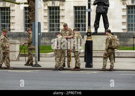 London, UK. 25th Apr, 2023. British army Soldiers in Whitehall mark out the route for the coronation Stock Photo