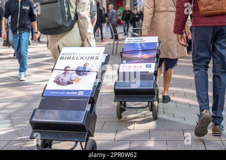 Jehovah's Witnesses with mobile information stands, with information in different languages, in the pedestrian zone near Cologne Cathedral, Stock Photo