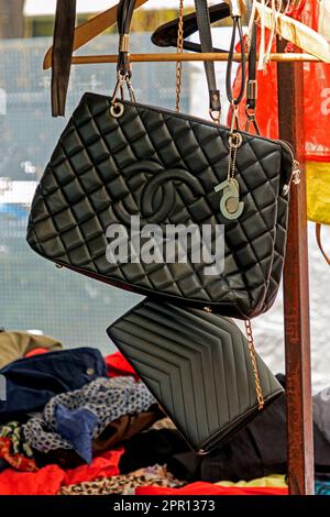 Belgrade, Serbia - April 09, 2023: Counterfeit expensive famous fashion labels leather bags sold on black market outdoors in city of Belgrade. Stock Photo