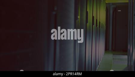 General view of empty server room with multiple black servers Stock Photo