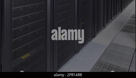 General view of empty server room with multiple black servers Stock Photo