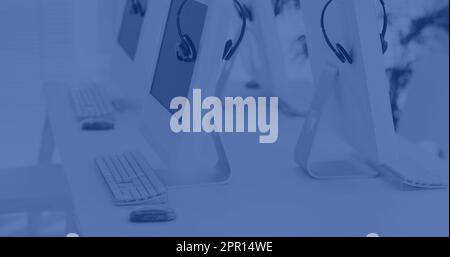 Composition of computers on desk in office Stock Photo