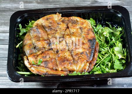 Traditional Egyptian dish Hawawshi, pita stuffed with minced meat and spiced with onions, pepper, parsely and chilies, baked by filling flat Egyptian Stock Photo