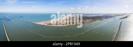 aerial panorama view of the landscape around the Maasvlakte a massive man-made extension of Europoort port and industrial facility within Port of Rotterdam in the Netherlands. High quality photo Stock Photo