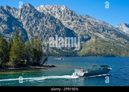 Shuttle boats on Jenny Lake in Grand Teton National Park ferry passengers to and from the far side of the lake Stock Photo