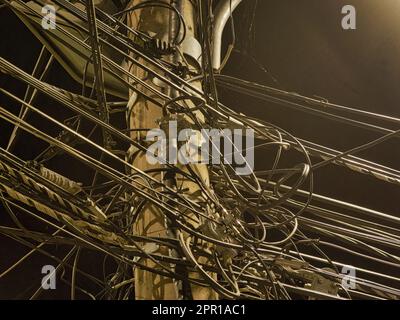 Electric pole wires in Prizren city by night Stock Photo