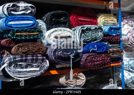 Material stacked in shop shot from outside looking in Stock Photo