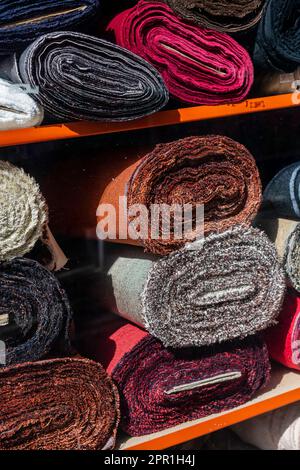 Material stacked in shop shot from outside looking in Stock Photo