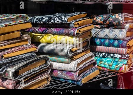 Material stacked in shop shot from outside looking in Stock Photo