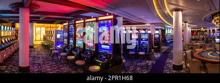 Las Vegas, Nevada, USA, March 10, 2023: Casino gambling blackjack and slot machines waiting for gamblers and tourist to spend money Stock Photo