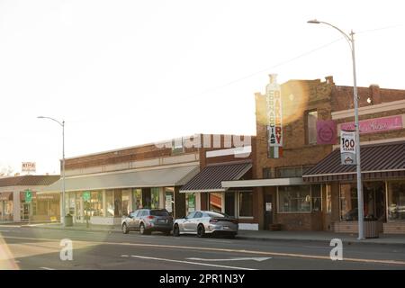 Chowchilla, California, USA - April 18, 2023: Late afternoon sunlight shines on the historic buildings of downtown Chowchilla. Stock Photo