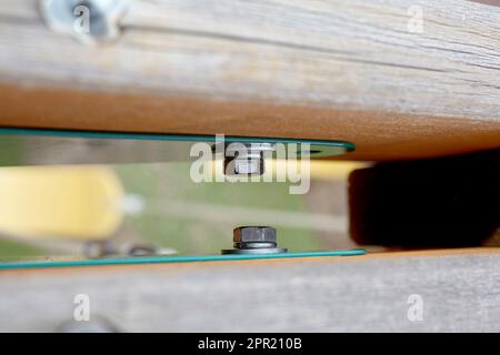Close up of a Hex nut and bolt on a Child's Swing set Stock Photo