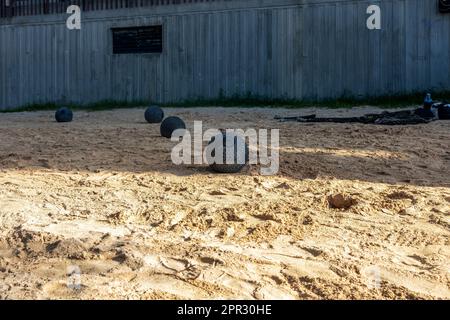 Fitness equipment on the beach sand for sports with medicine balls and ropes. Fitness concept. Stock Photo