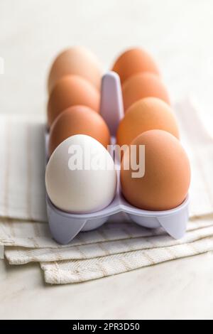 Whole chicken eggs on the kitchen napkin. Stock Photo