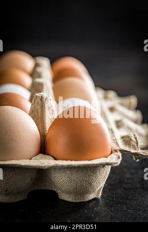 Whole chicken eggs in the eggbox. Stock Photo