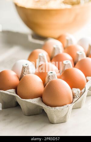 Whole chicken eggs in the eggbox. Stock Photo