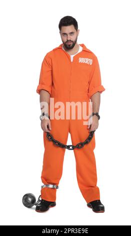 Prisoner in jumpsuit with chained hands and metal ball on white background Stock Photo