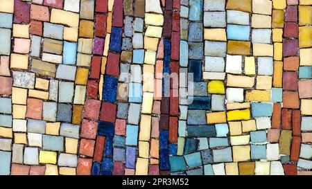 Detail of a colorful, very old mosaic of square little pieces Stock Photo