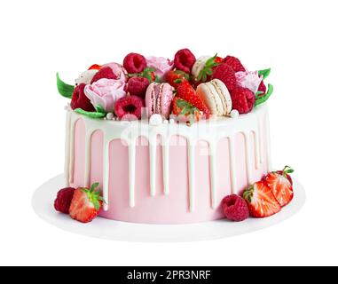 Birthday sweet cake with berries, macaron and floral decor isolated on a white background. Beautiful pink cake decorated with macarons, raspberries, s Stock Photo