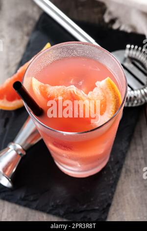 Sea breeze cocktail in glass on wooden table Stock Photo