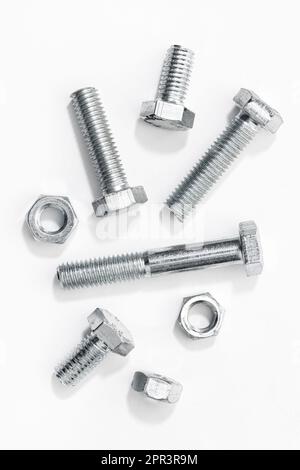 Metric Bolts and nuts isolated on white background Stock Photo