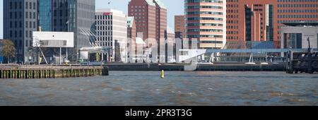 Rotterdam, Netherlands - Bridgewatcher's House and quayside development by Bolles Wilson over River Maas Stock Photo