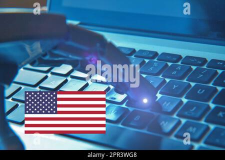 Robotic hand typing on a keyboard with the American Flag. . Concept of investments on future and AI. Stock Photo