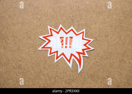 Three red exclamation marks in speech bubble on neutral background.  Keep attention concept,  importance background, warning. Stock Photo
