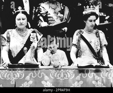 File photo dated 02/06/53 of Prince Charles looking solemn as he stands chin on hand between the Queen Mother and Princess Margaret in the Royal Box at Westminster Abbey, from where he saw Queen Elizabeth II crowned. Issue date: Wednesday April 26, 2023. Stock Photo