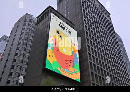 SEOUL, SOUTH KOREA - APRIL 6, 2023: LG UPlus mobile operator and Apple iPhone 14 big display advertisement in downtown Seoul. Stock Photo