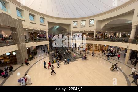 Dubai, United Arab Emirates - 12th June, 2022 : wide angle view of the shoppers walking about and shopping at the Deira city center mall. Stock Photo