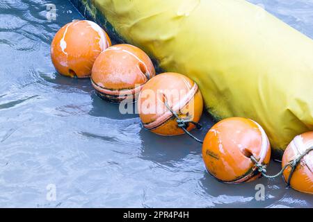 Orange buoy Used in the form of water made from special plastic that is strong and durable Stock Photo