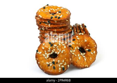 Round salty pretzels wtih black and white sesame isolated on white background high quality details Stock Photo